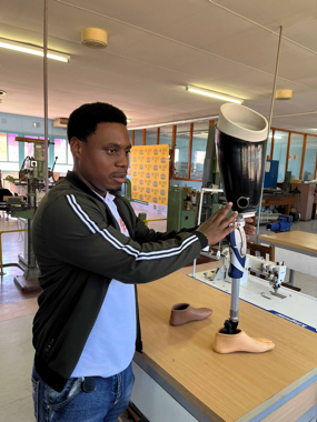 Kihuluma-Ngamila,-a-medical-prosthetist-and-orthotist-demonstrates-the-building-of-a-patients-new-limb.--Pietersburg-Hospital,-Polokwane,-South-Africa.--April-13,-2023