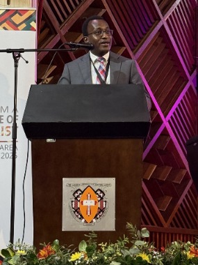 Elder George Munene, Area Seventy, addresses young single adults during YSA conference. Nairobi, Kenya, August 30, 2025