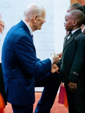 Elder Dale G. Renlund With Young Boy , Zambia, 22 February, 2025.