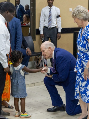 Elder-and-Sister-Renlund,-Brazzaville-to-Kenya.--Elder-Renlund-greets-a-young-member-in-Brazzaville