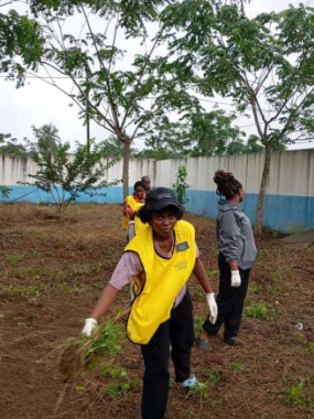 Church members clean and weed the couryard of the dispensary on 30 August, 2025.