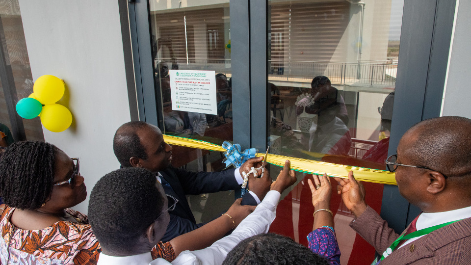 Elder Samuel Annan-Simons, Area Seventy for the Accra area, cuts the ribbon to formally hand-over the computer lab on 29 January, 2025.