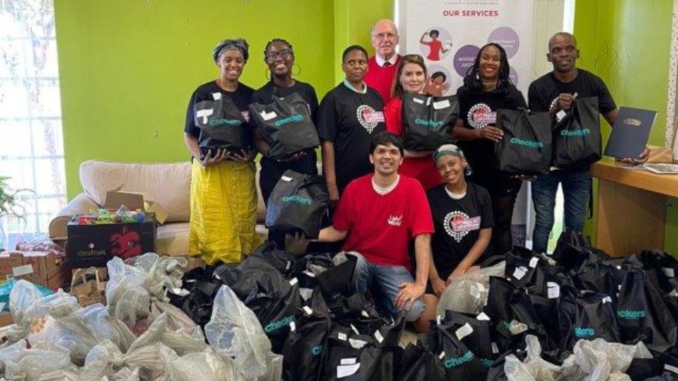 Cape Town #LightTheWorld volunteers hand over donations to a local shelter. 