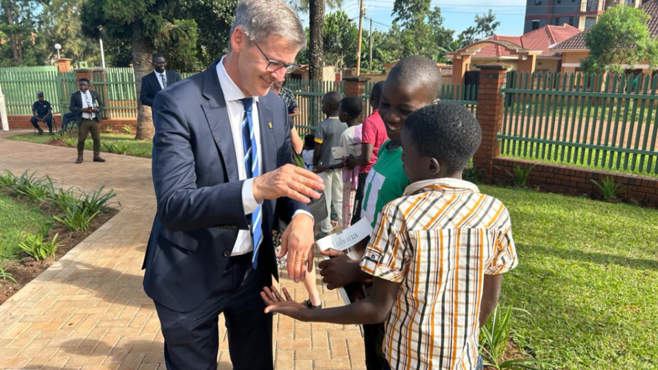 General-Church-Leaders-in-Uganda.-Young-Men-General-President-Steven-J.-Lund-is-Greeted-by-Children-upon-Arriving-at-the-Jinja-Stake-Center,-Jinja,-Uganda,-May-21,-2024