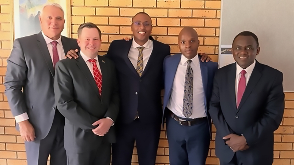Elder-Edward-Dube-(far-right)-of-the-Africa-South-Area-Presidency-and-Area-Seventy-Authority-Elder-Glenn-M.-Holmes-(far-left)-pictured-with-the-stake-presidency-of-the-Newly-created-Johannesburg-South-Stake-President-Sandile-Makasi-(centre),-with-first-counsellor-President-Olev-Nathan-Taim-(left)-and-second-counsellor-President-Frederick-Nikosingiphile-Ntombela-(right).