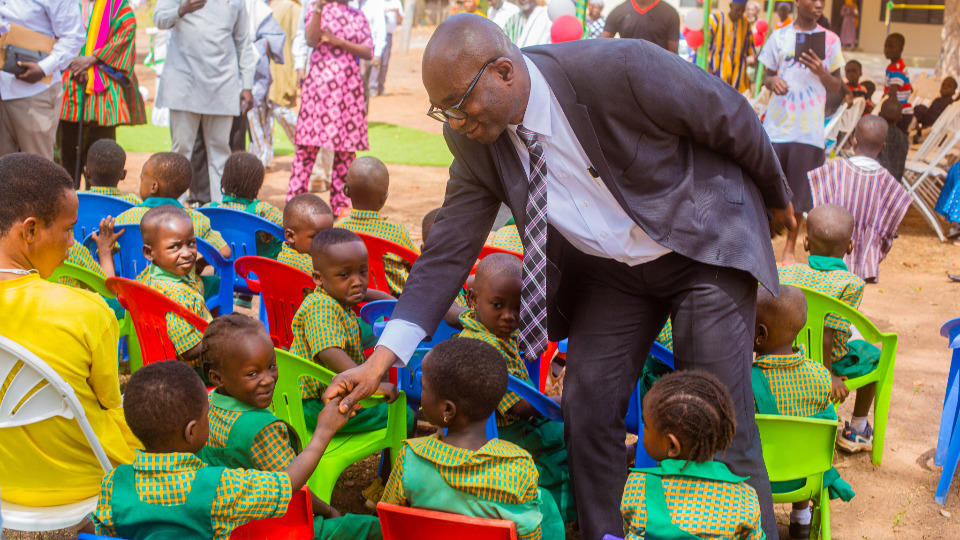 Elder Morrisosn greets children at the orphanage on 28 November, 2024.