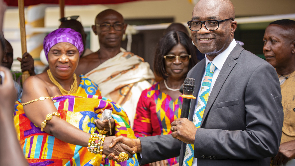 Elder Morrison hands over the keys to the new medical clinic on 19 June, 2025.