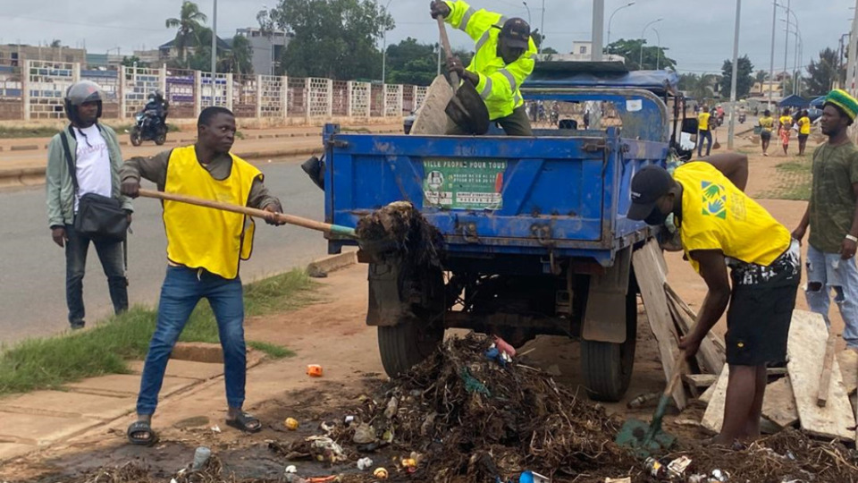 Members of the Lomé Togo Agoé Stake clean surroundings of a clean water reservoir on 16 August, 2025.