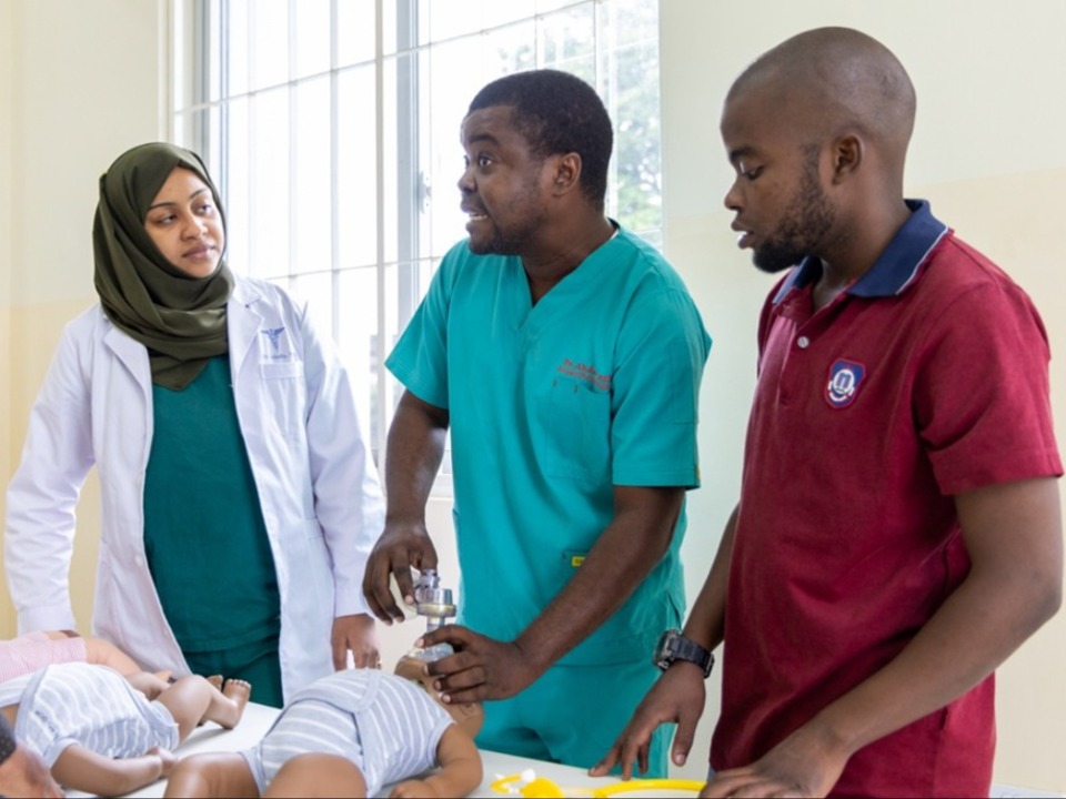Dr. Suhaila Mohammed (Left) and Dr Akilimali Masunzu (right) are trained by Dr. Abdulaziz Omar Abbas using mannequins at the Zanzibar Skill Lab, Zanzibar on August 27th, 2025