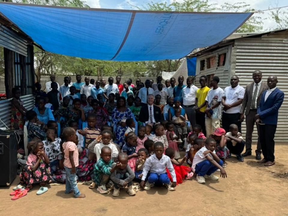 Kakuma Branch members with family and friends, together with Nairobi West Mission President David Sturt, his 2nd counselor, President Meshack Odunga. April 6th, 2025