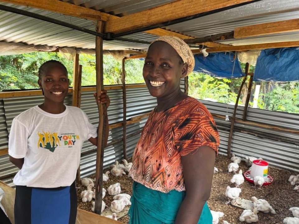 Silvia (right) with daughter Nelly in their chicken coop. Mombasa, Kenya